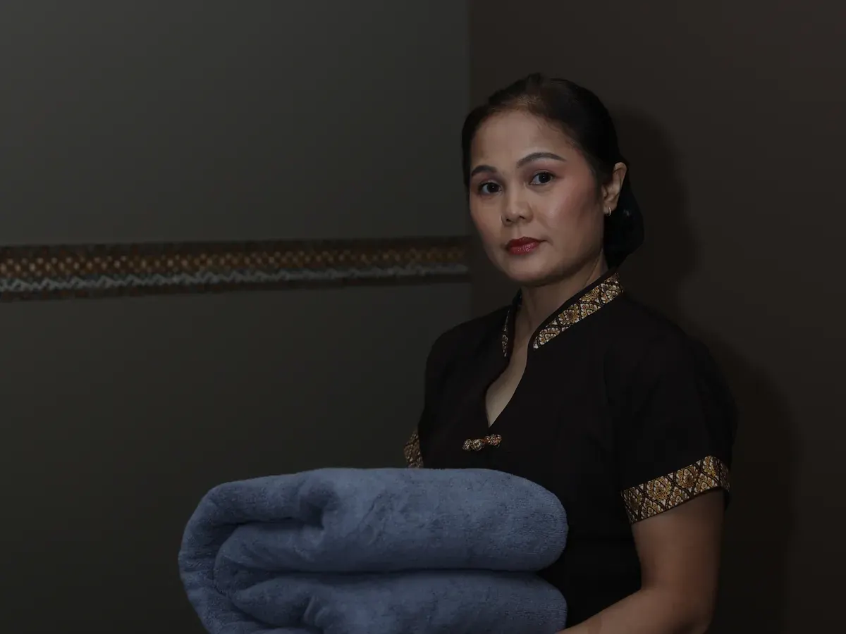 OM Massage therapist preparing to welcome a client